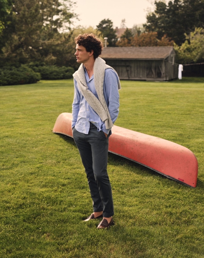 A preppy vision, Simon Nessman dons a J.Crew cashmere cable-knit sweater with a 484 slim-fit stretch chino and Camden leather-soled loafers.