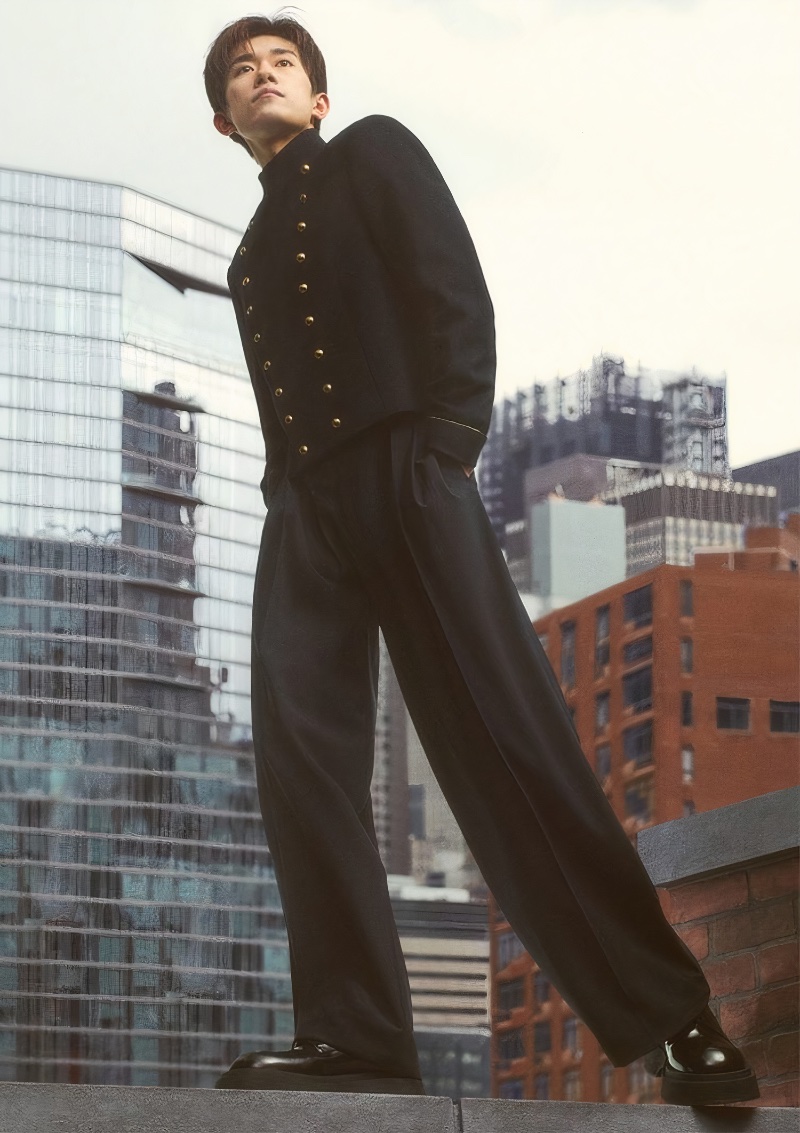 Standing out in a military-style jacket and wide-leg trousers, Jackson Yee appears in Emporio Armani's fall-winter 2023 campaign.