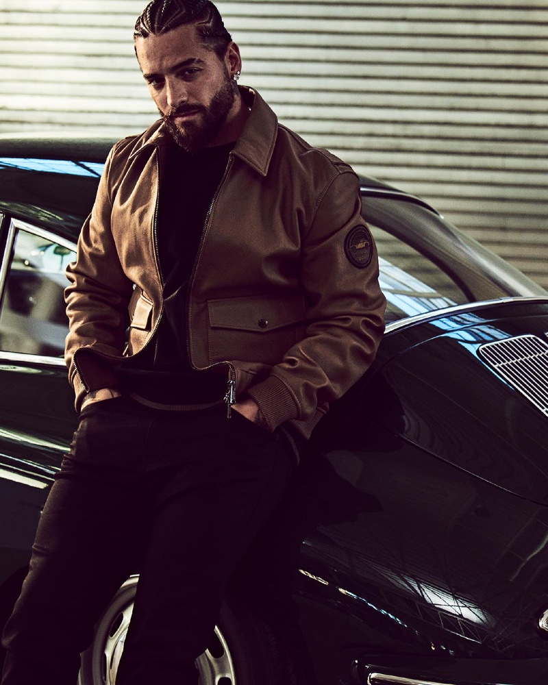 Maluma wears a brown leather bomber jacket for the Porsche x BOSS fall-winter 2023 campaign.