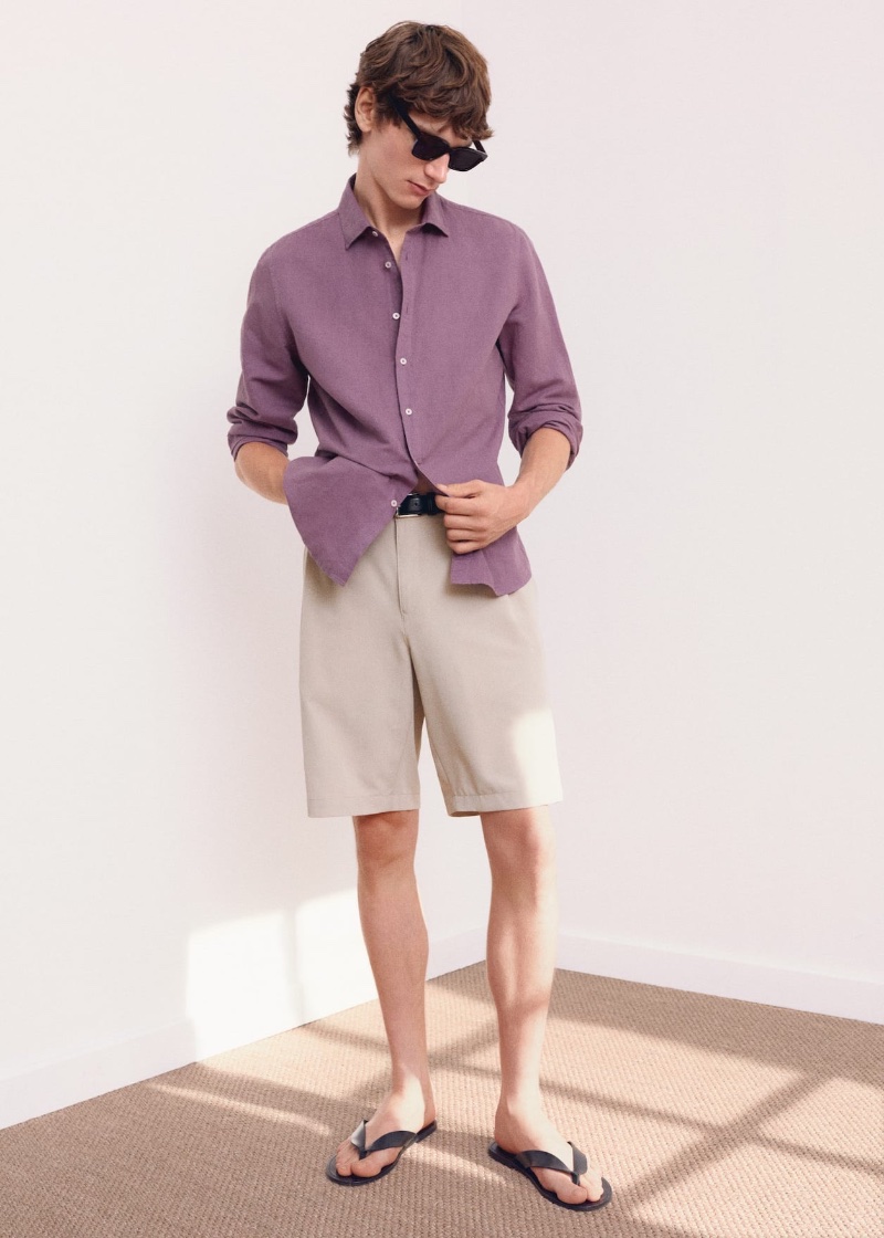 Wearing Mango's summer style, Erik van Gils dons a plum-colored linen shirt with shorts. 