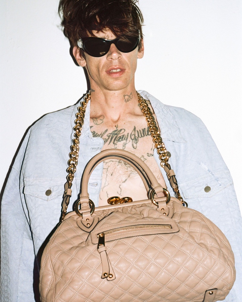 Model Cole Mohr wears the Marc Jacobs Re-edition Quilted Leather Stam Bag.