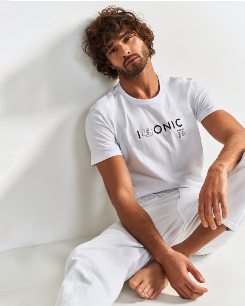 Donning all white, Marlon Teixeira fronts Colcci's spring 2024 campaign.