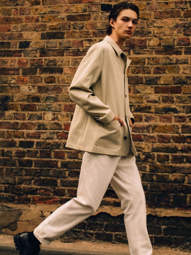 On the move, Dante Scheck sports a cotton overshirt with straight-fit selvedge jeans from the fall-winter 2023 Massimo Dutti Studio collection.