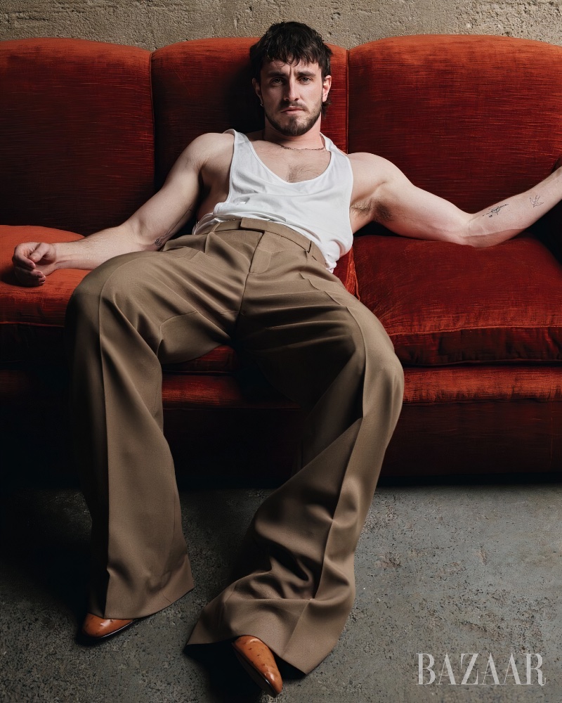 Actor Paul Mescal wears a Gucci tank with trousers and boots. For accessories, Mescal dons Cartier.