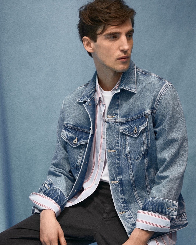 Model Anatol Modzelewski takes the spotlight in a jean jacket paired with a striped shirt from Pepe Jeans.