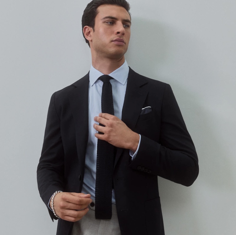 Traditional professional style takes the spotlight as Mattia Narducci wears a blazer with a striped dress shirt and knit tie. » REISS Unveils Elegant Office Attire: The Sartorial Heroes Traditional professional style takes the spotlight as Mattia Narducci wears a blazer with a striped dress shirt and knit tie.