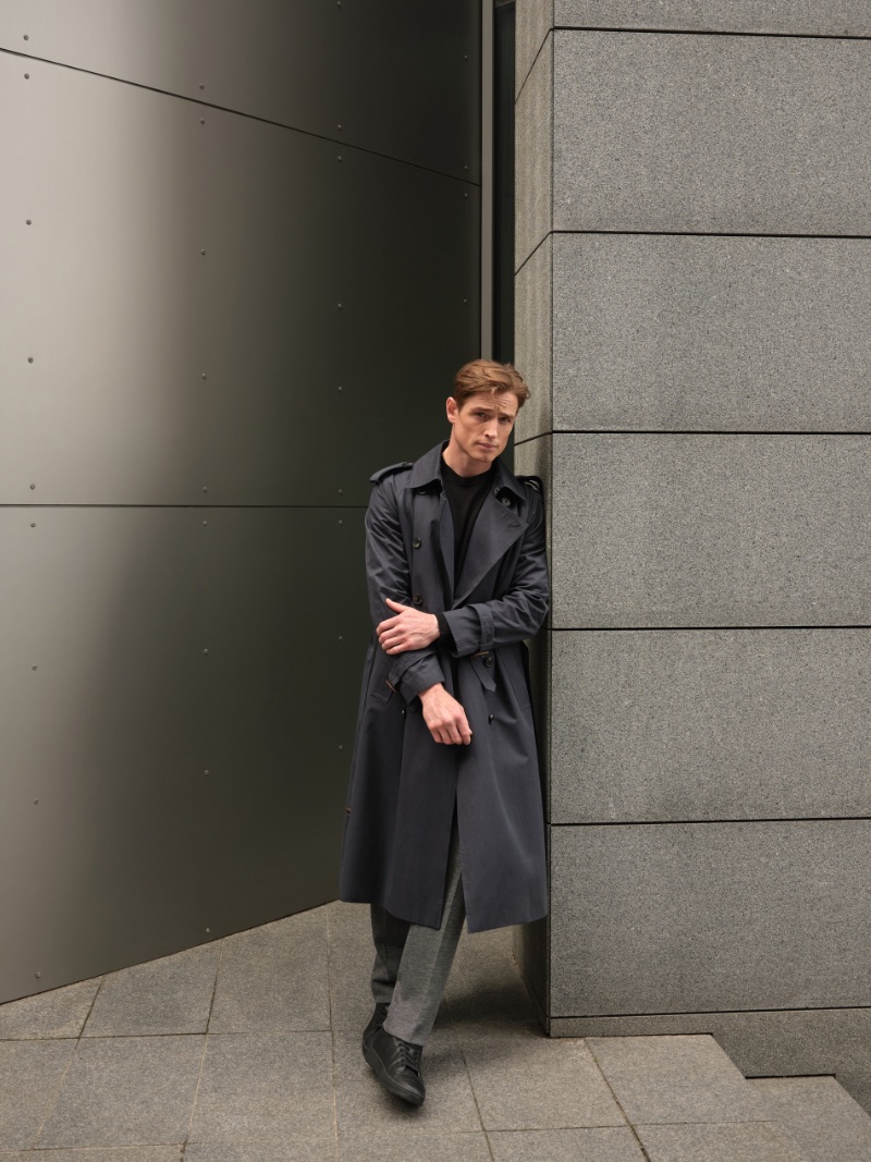 Embracing professional style, Patrick O'Donnell rocks a Reserved double-breasted trench with a merino wool sweater and suit trousers. » Reserved Fall 2023 Update: Back to Business Embracing professional style, Patrick O'Donnell rocks a Reserved double-breasted trench with a merino wool sweater and suit trousers.