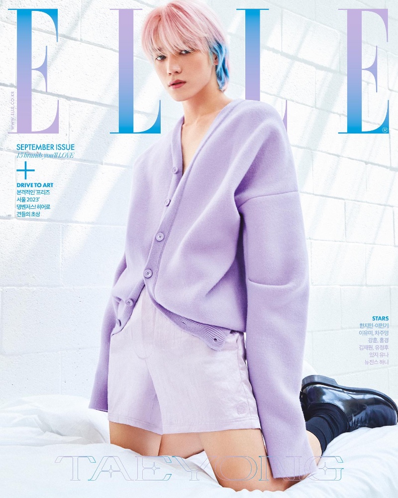 Making a statement in lilac, Taeyong wears a Loewe cardigan and shorts for the September 2023 cover of Elle Korea.