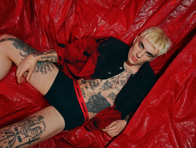 Tanner Reese rocks black underwear with a red waistband for HUGO's fall-winter 2023 campaign.