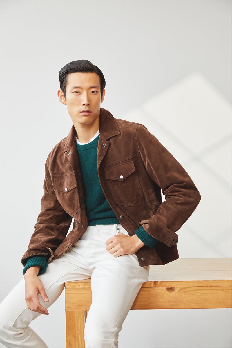 Juhyung Kang models a Todd Snyder Italian suede Dylan jacket with a cashmere crewneck and classic fit selvedge jeans. 