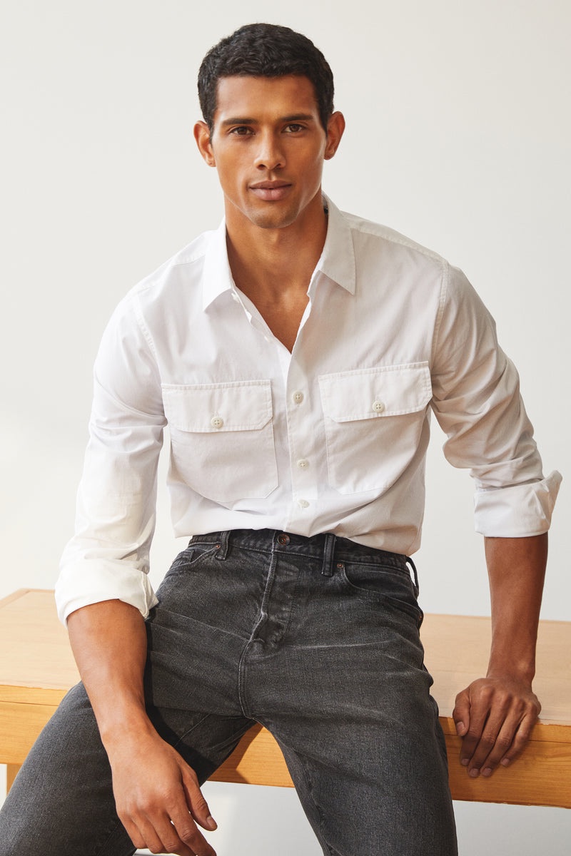In front and center, Jonas Barros sports a Todd Snyder two pocket poplin shirt with relaxed fit selvedge jeans. 