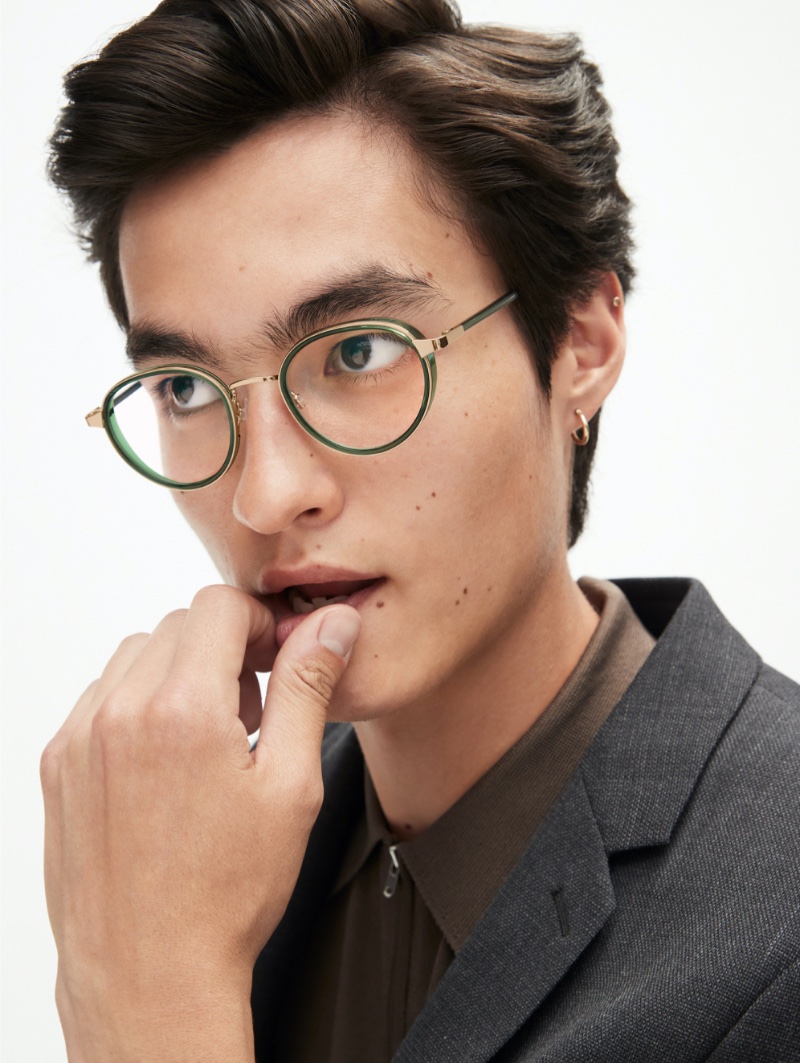 Douglas Dillon wears Warby Parker's Nestor glasses in Nori Crystal with Polished Gold.