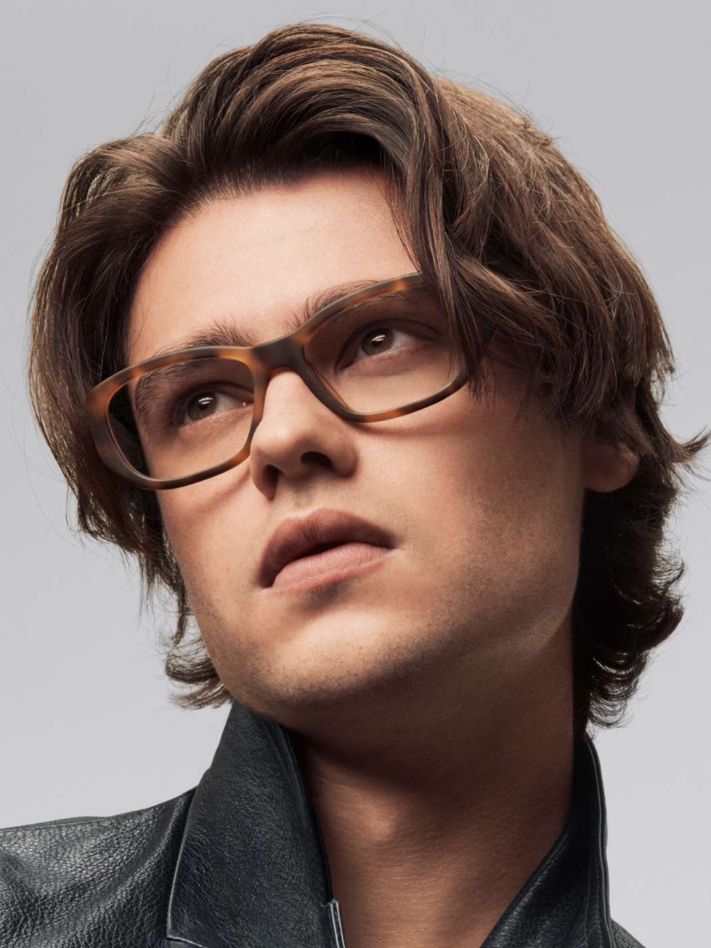 Felix Mallard dons Warby Parker's Anju glasses in Oak Barrel Matte.