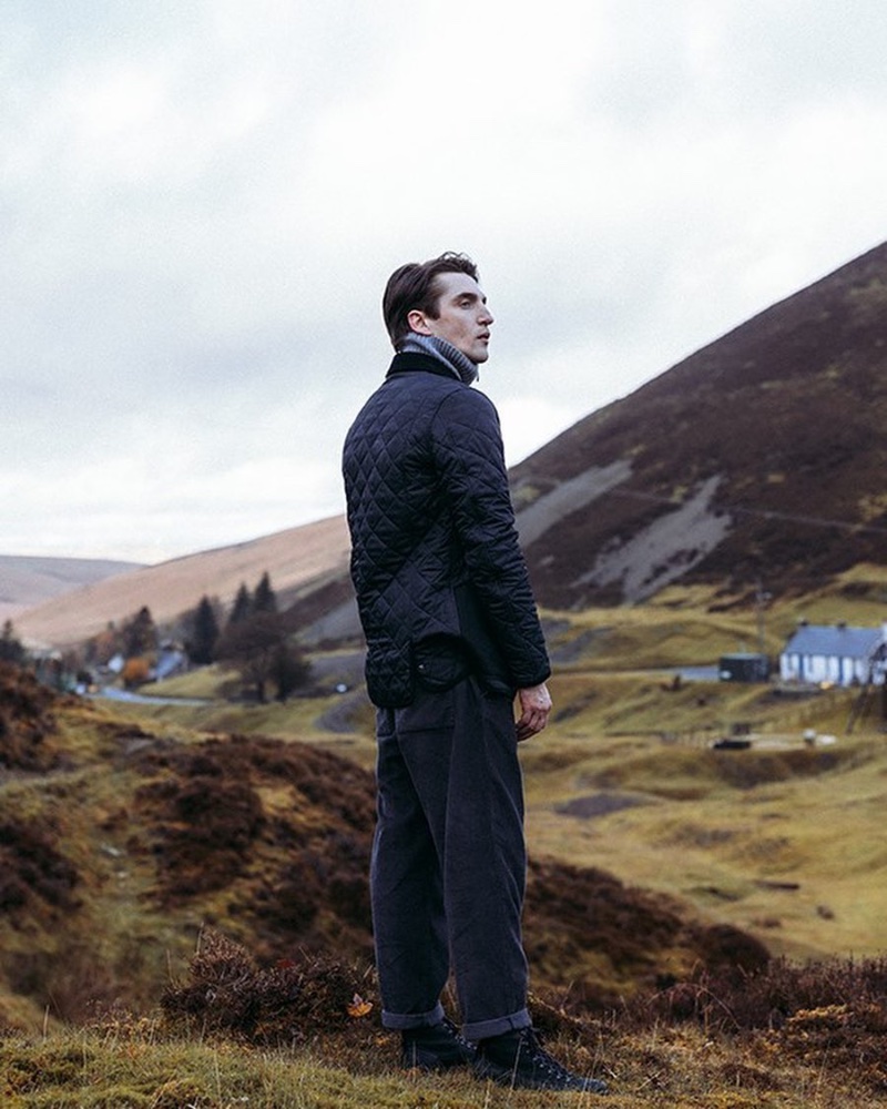 Anatol Modzelewski models a quilted Barbour jacket in navy.