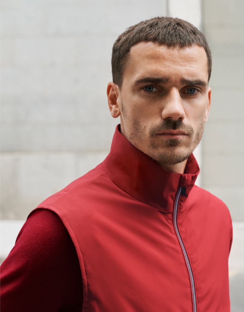 Antoine Griezmann sports a red quilted vest and merino wool washable sweater from Mango's Performance collection. 