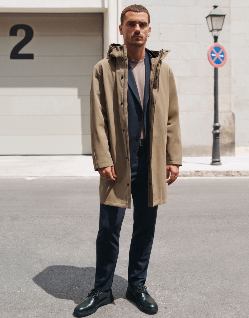 In front and center, Antoine Griezmann wears a parka with a slim-fit wool suit jacket and cotton t-shirt from Mango's Performance collection.
