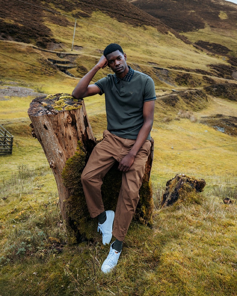 Taking the spotlight, Grace Musase wears a Barbour polo shirt. » Barbour Fall 2023: Embracing Scottish Heritage Taking the spotlight, Grace Musase wears a Barbour polo shirt.