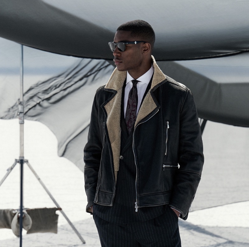 Niyo Malik sports a leather jacket with a pinstripe suit for Brunello Cucinelli's fall-winter 2023 campaign.