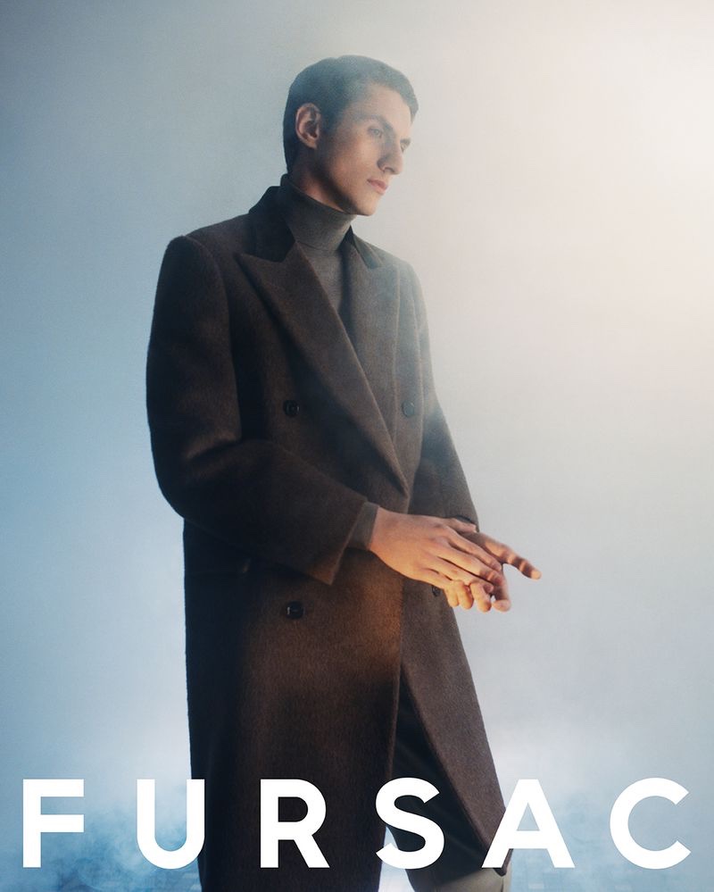 Model Henry Kitcher sports a double-breasted coat for Fursac's fall-winter 2023 campaign. 