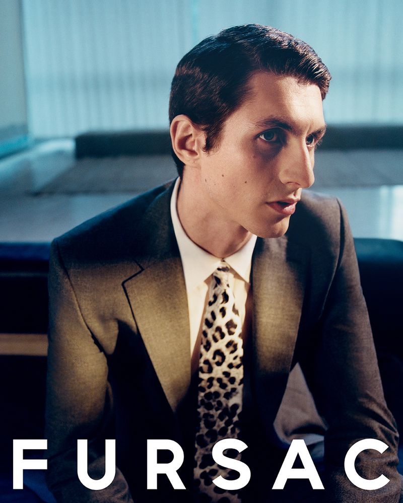 Donning a sharp suit with a leopard print tie, Henry Kitcher fronts Fursac's fall-winter 2023 campaign.