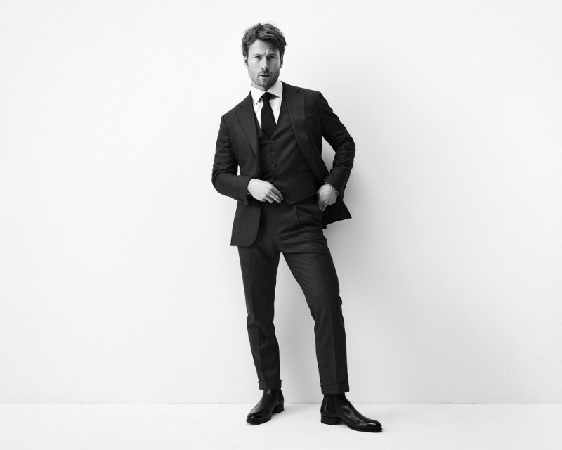 Glen Powell wears a bespoke 3-piece suit for Brioni's fall-winter 2023 campaign.