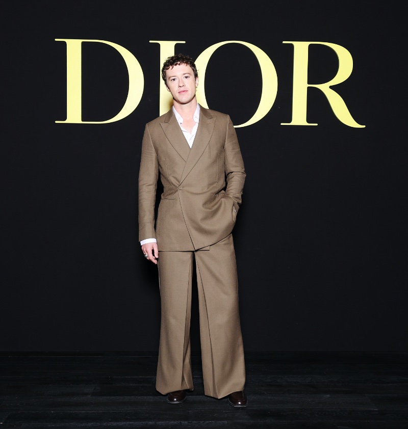 Joseph Quinn makes a case for brown in a Dior Men double-breasted suit. 