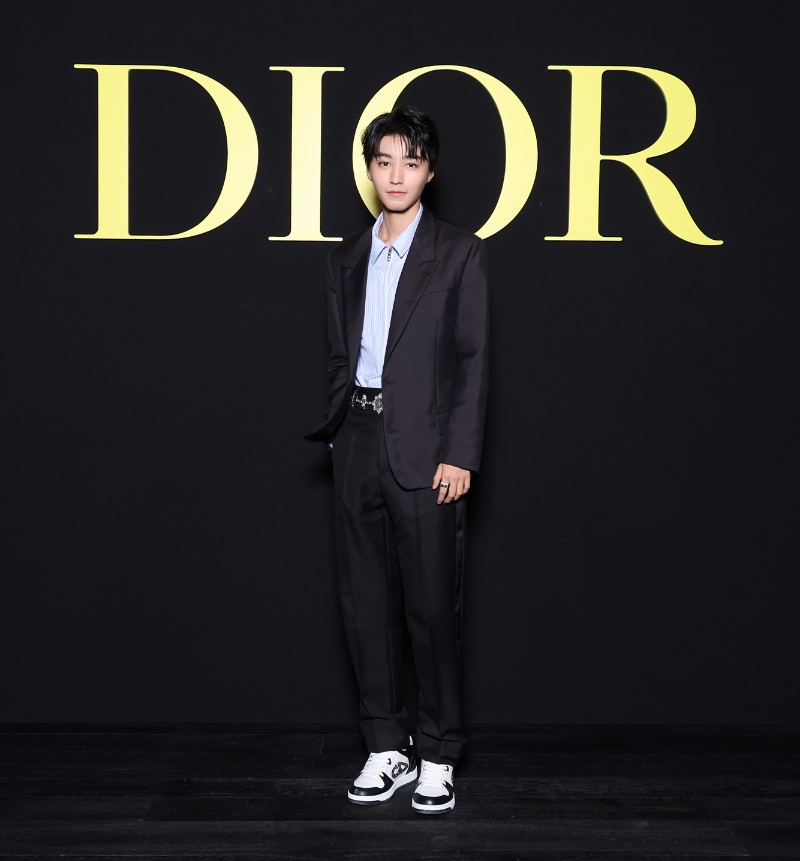 A refined vision, Karry Wang wears a navy Dior Men suit. 