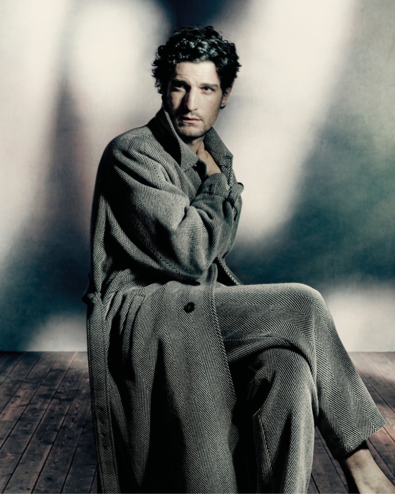 French actor Louis Garrel is a chic vision for Giorgio Armani's fall-winter 2023 campaign. 