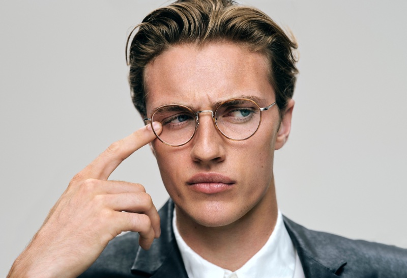 Lucky Blue Smith wears Oliver Peoples' Sidell glasses for the brand's fall 2023 campaign.