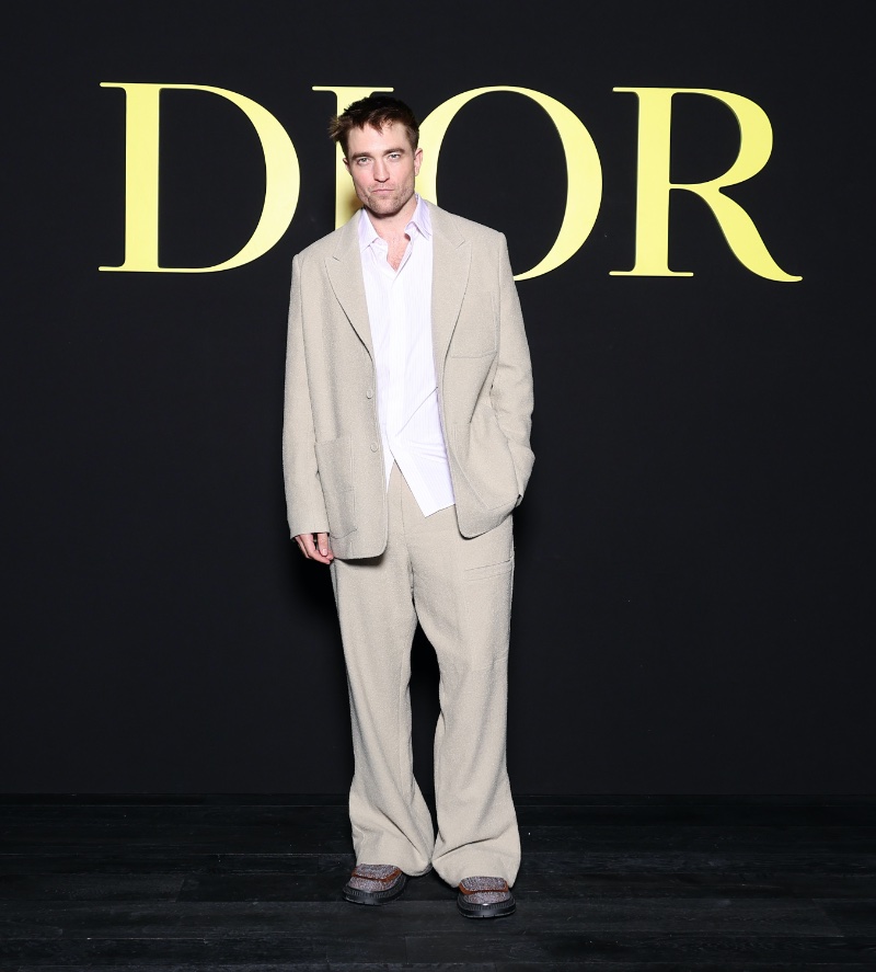 Dior ambassador Robert Pattinson wears a beige suit to the brand's spring-summer 2024 women's show. » Robert Pattinson, Apo + More Go Sartorial at Dior Show Dior ambassador Robert Pattinson wears a beige suit to the brand's spring-summer 2024 women's show.