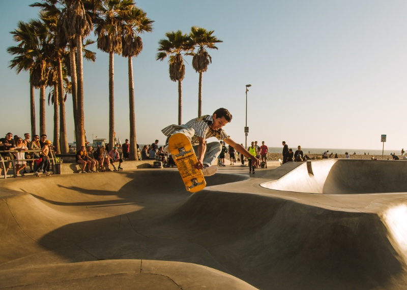 A skateboarder performs a sick trick in Venice Beach, California.