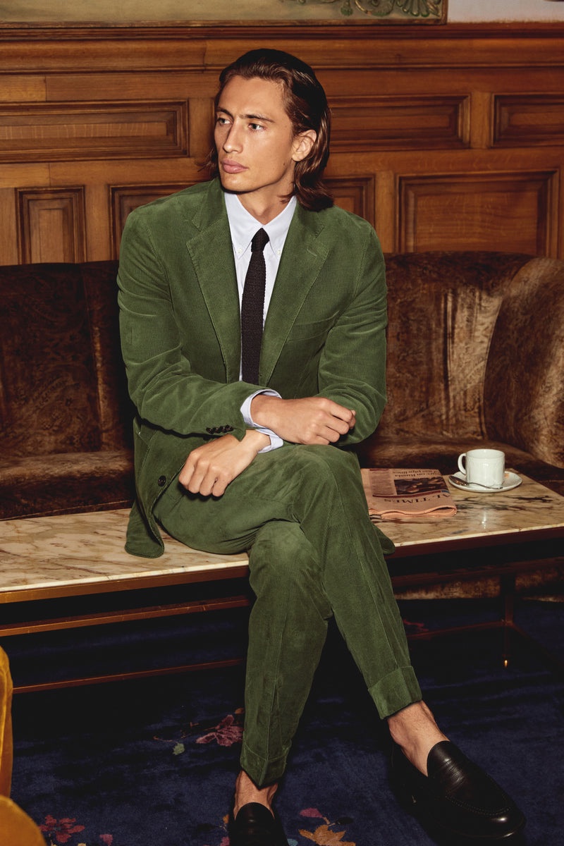 Make a sartorial statement in Todd Snyder's green Italian corduroy Madison suit jacket and pants. Here, James Turlington wears the suit with a slim-fit poplin shirt, Italian silk knit tie, and Sanders x Todd Snyder loafers. 