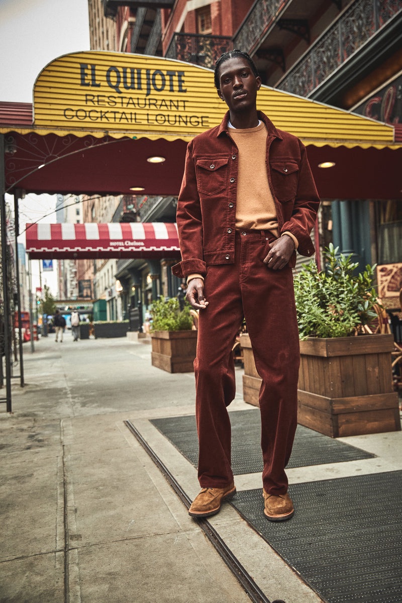 Todd Snyder's Corduroy Dylan jacket and slim-fit 5-pocket corduroy pants steal the spotlight as Anarcius Jean wears the must-haves with a cashmere sweatshirt and Sanders x Todd Snyder boots.