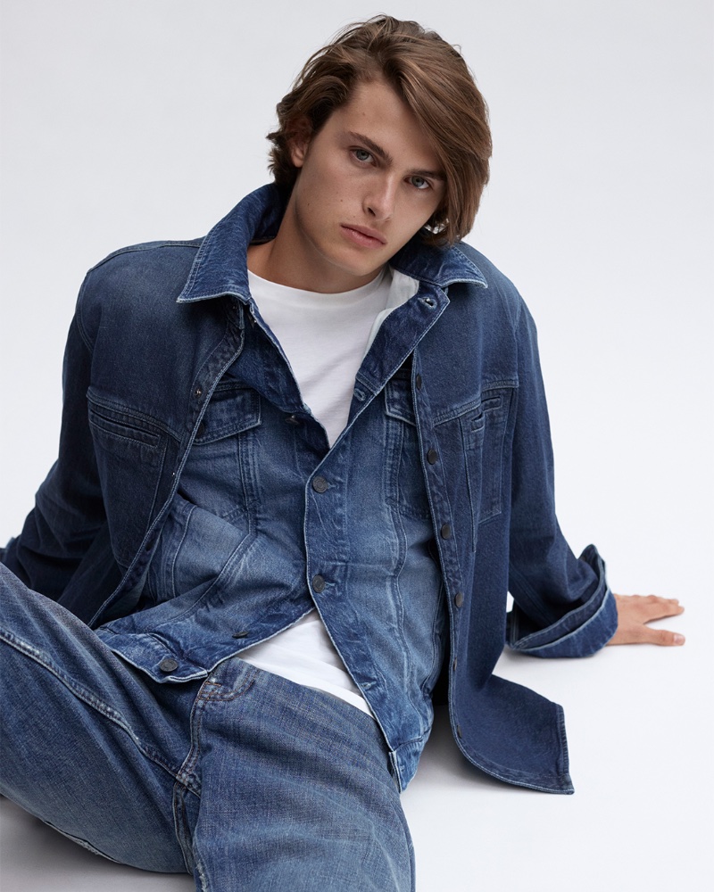 Mark Vanderloo Jr. inspires in a denim-on-denim ensemble, wearing a jean jacket with an overshirt and jeans.