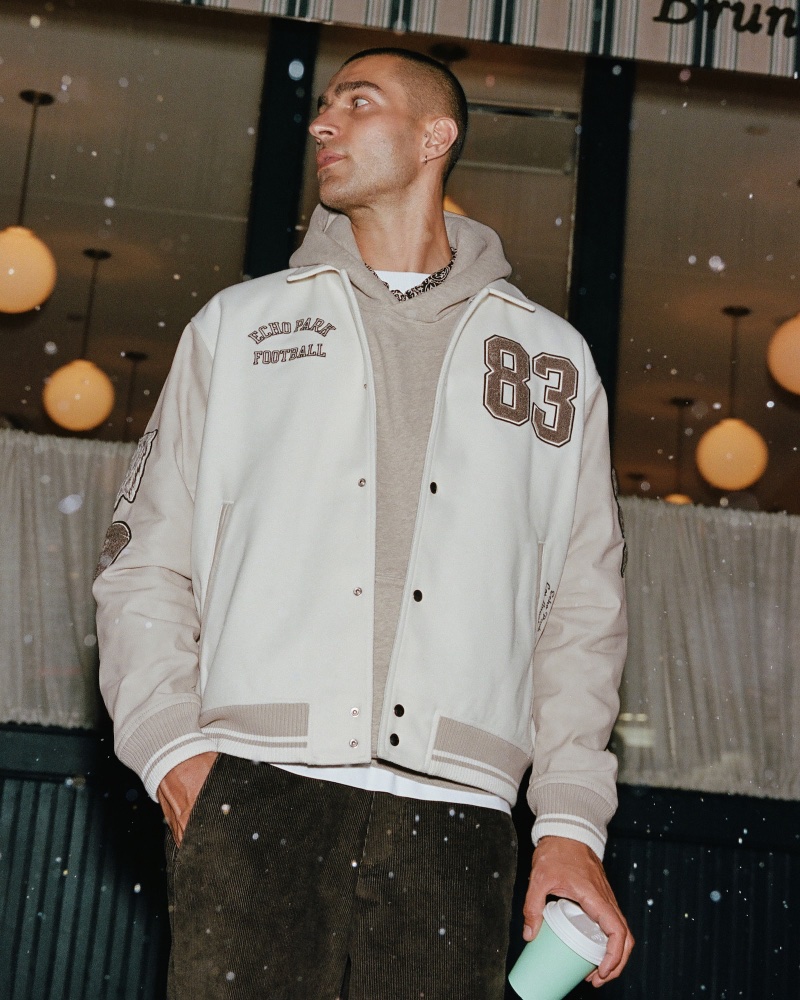 Abercrombie & Fitch makes a case for the varsity bomber jacket in fall neutral tones. 