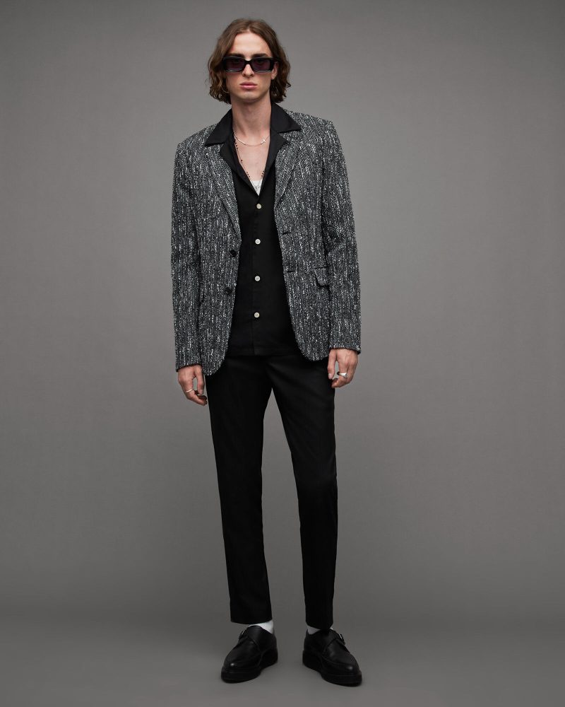 Don a tailored blazer for the club, wearing a stylish shirt underneath in case you go sans jacket. 
