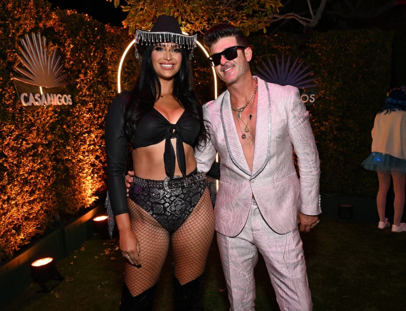 April Love Geary and Robin Thicke enjoy an evening out at the Casamigos Halloween party.