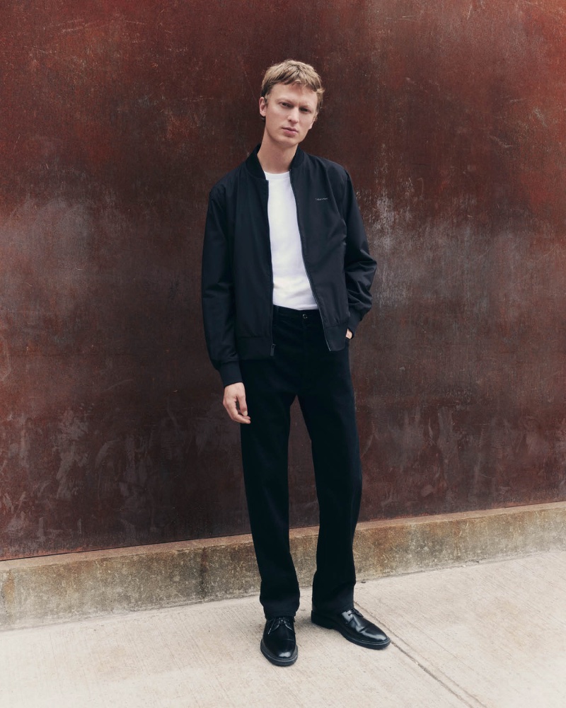 Jonas Glöer takes the spotlight in a bomber jacket for Calvin Klein's fall-winter 2023 essentials campaign.