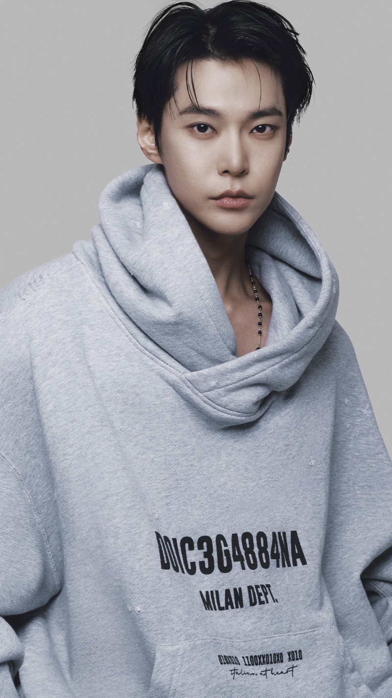 Sporting an oversized hoodie, Doyoung appears in Dolce & Gabbana's fall-winter 2023 advertising campaign.