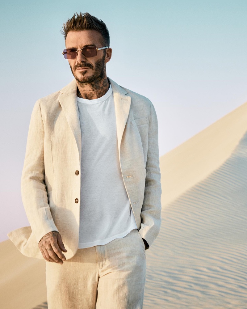 A chic vision, David Beckham dons the DB 7109/S Gold Crystal Burgundy sunglasses.