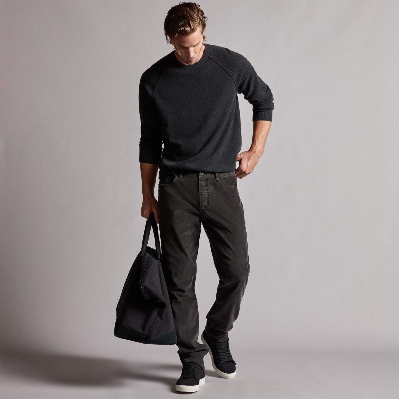 Go casual and dark in a cashmere sweater and jeans.