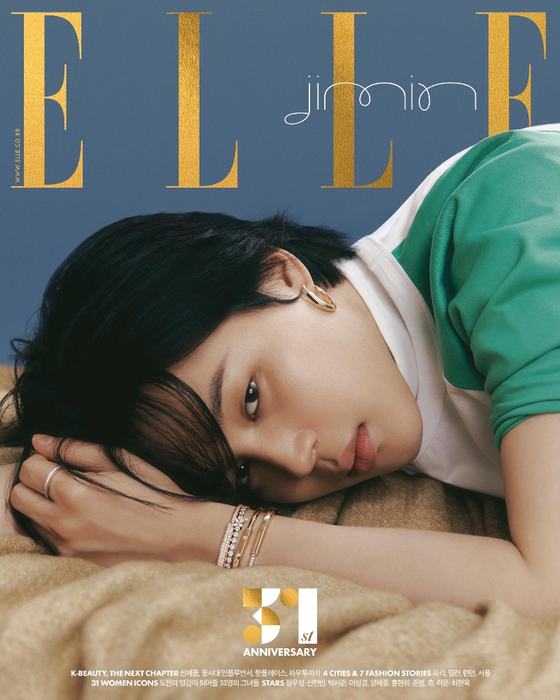 Clad in Tiffany & Co. jewelry, Jimin wears bangles, earrings, and a ring for the November 2023 cover of Elle Korea. 