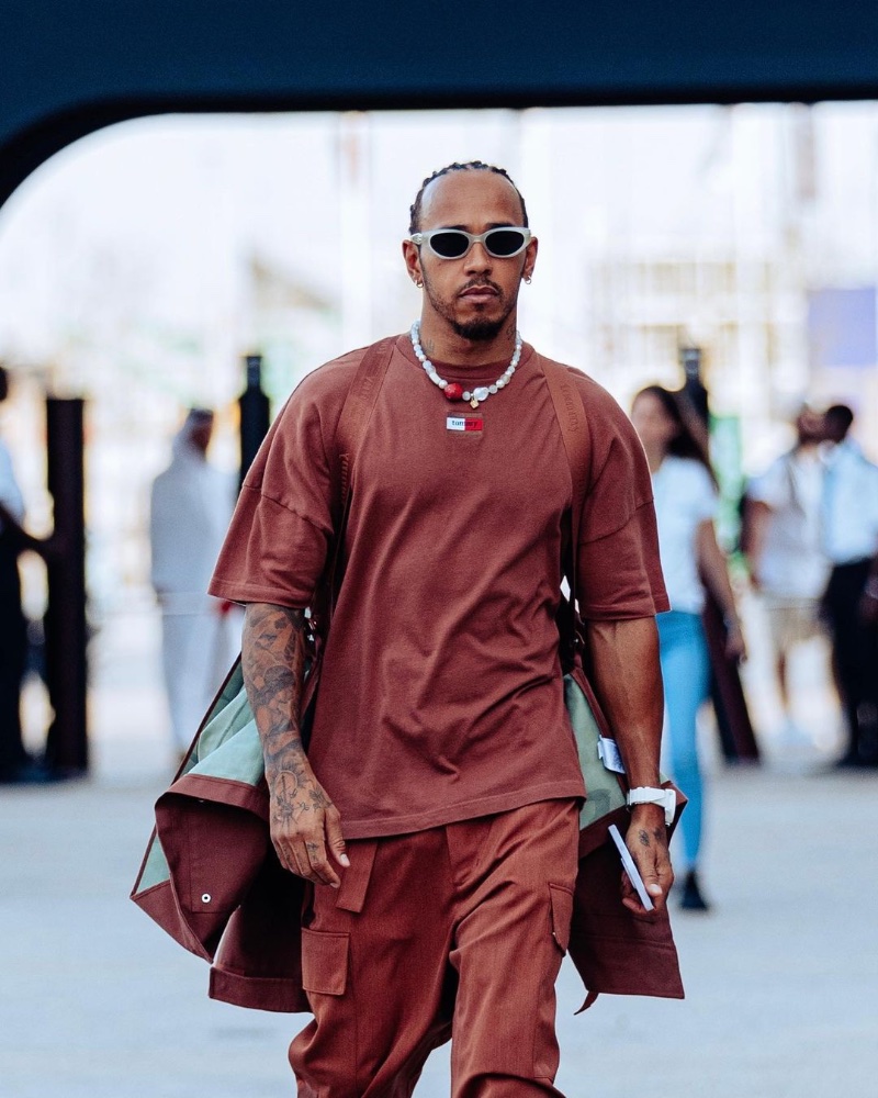Lewis Hamilton wears a monochromatic look from Tommy Hilfiger. 