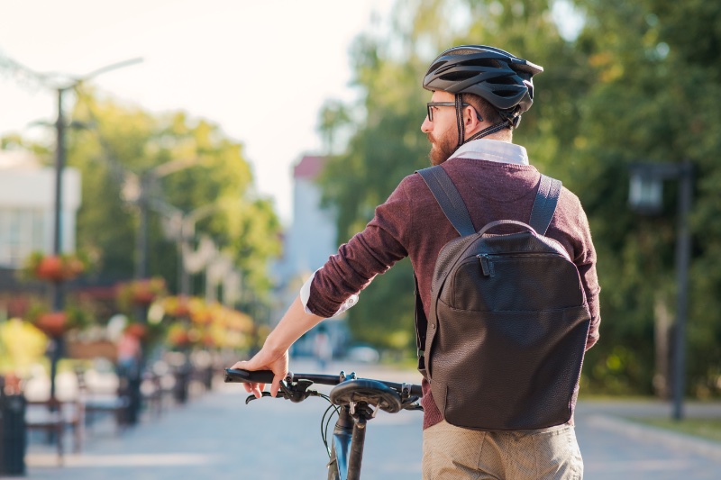 Man Cycling to Work Safety Helmet
