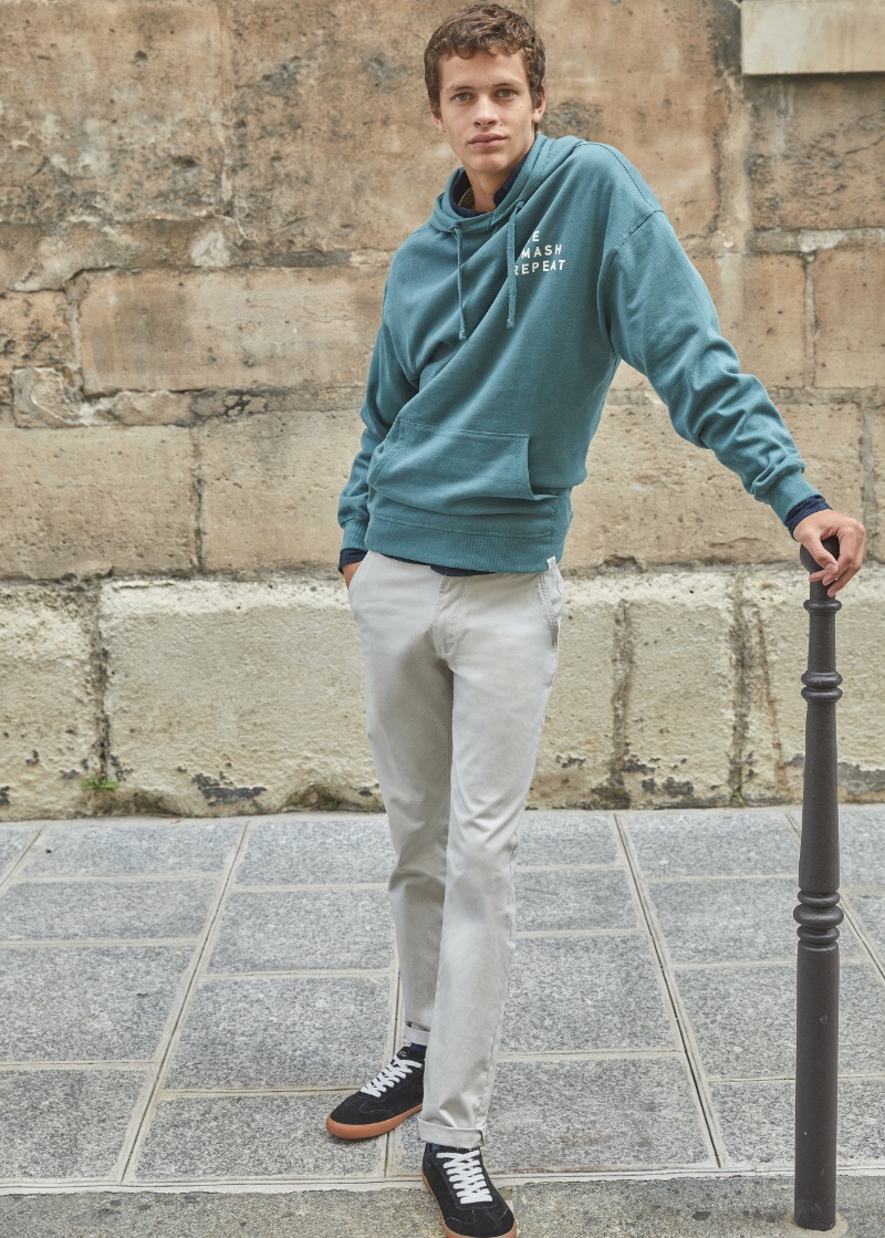 Sporting a casual ensemble for fall, Adrian Planas models a look from Mango Teen.