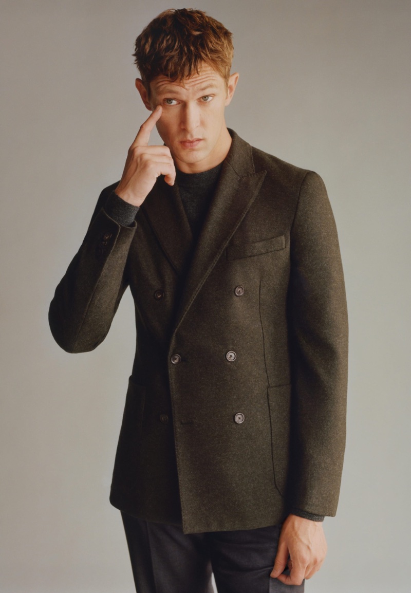 Danish model Mathias Lauridsen dons a virgin wool double-breasted blazer from the Mango designed by Boglioli.