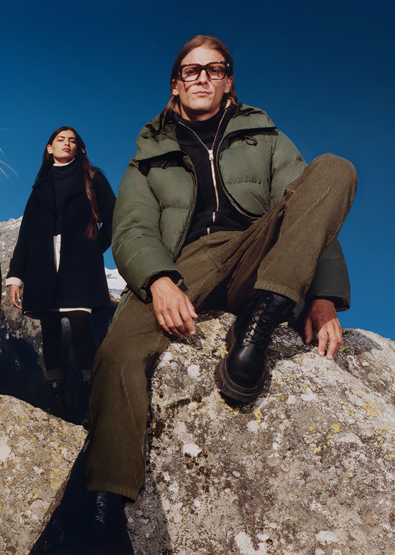 Sporting a puffer, Victor Le Dauphin stars in Marc O'Polo's fall-winter 2023 campaign. 