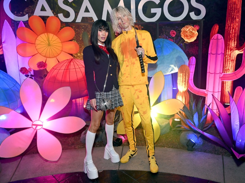 Wearing Kill Bill costumes, Megan Fox and Machine Gun Kelly pose for pictures at the 2023 Casamigos Halloween party.