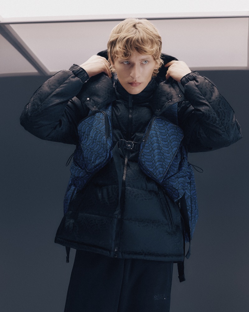 Ready for the cold, Nikita Stsjolokov models a Moncler x adidas Originals Alpbach logo-jacquard quilted down coat.