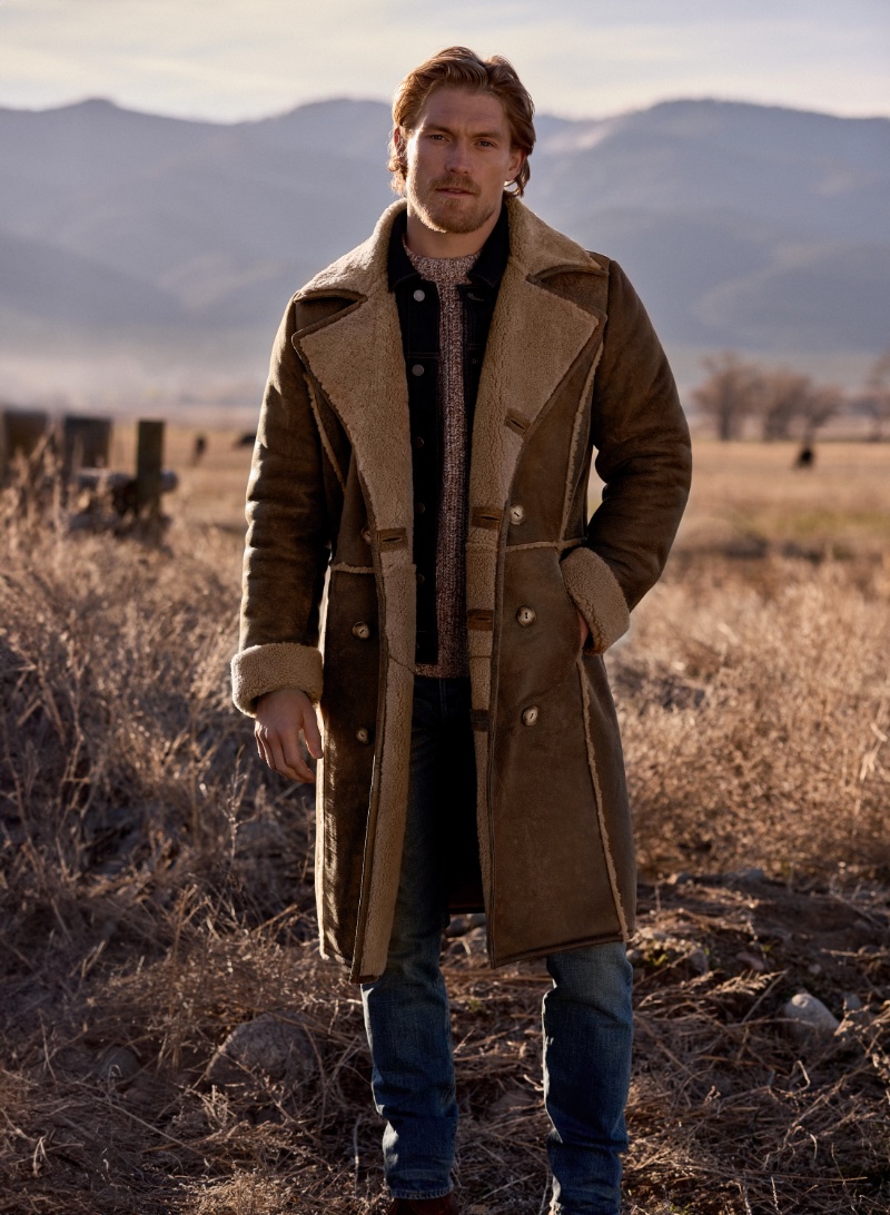 Making a luxurious statement, Harry Goodwins models Overland Sheepskin Co.'s Highlander Shearling Sheepskin Coat.